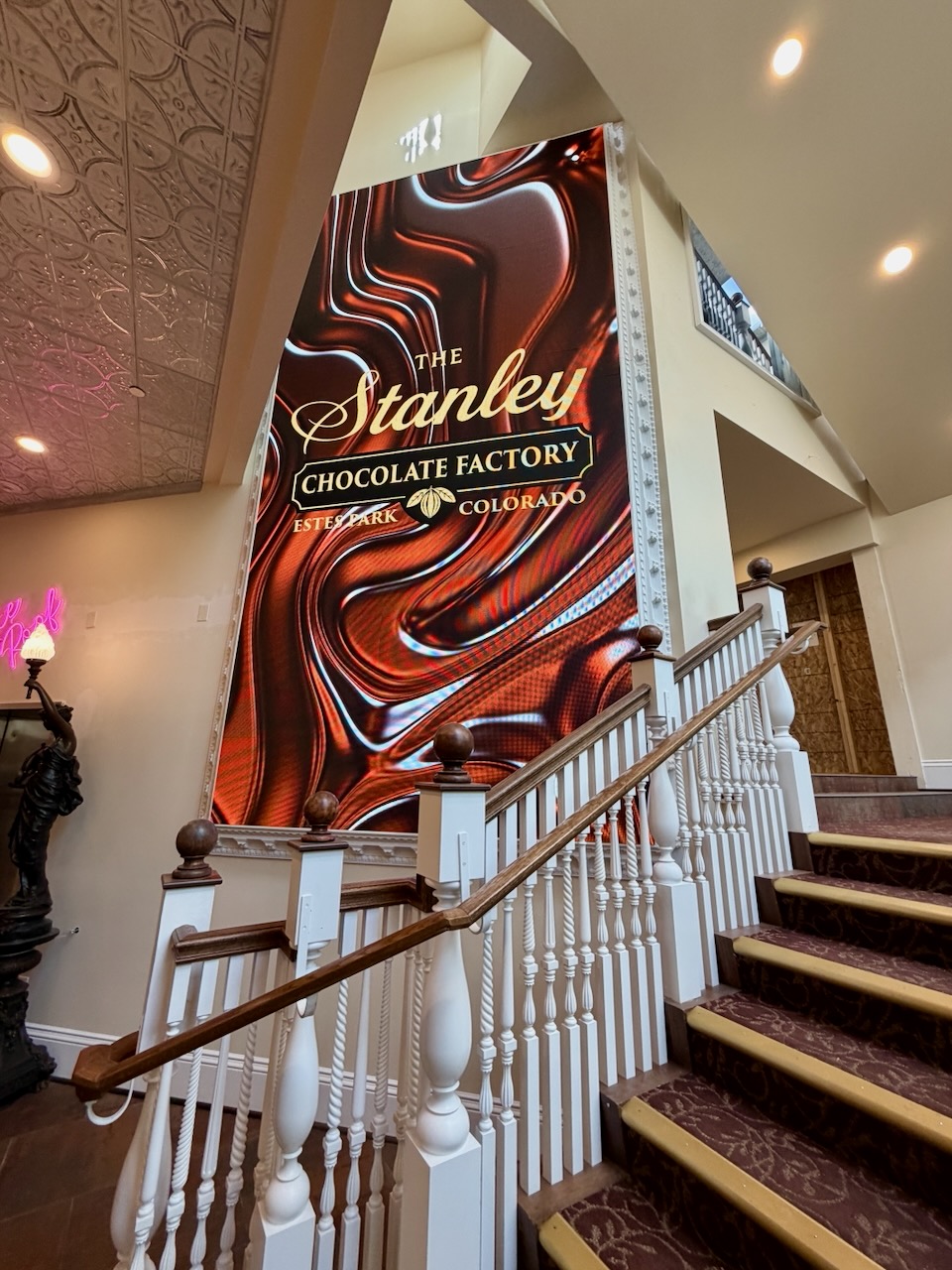 Finished LED wall showing the Stanley Chocolate Factory logo over a chocolate swirl