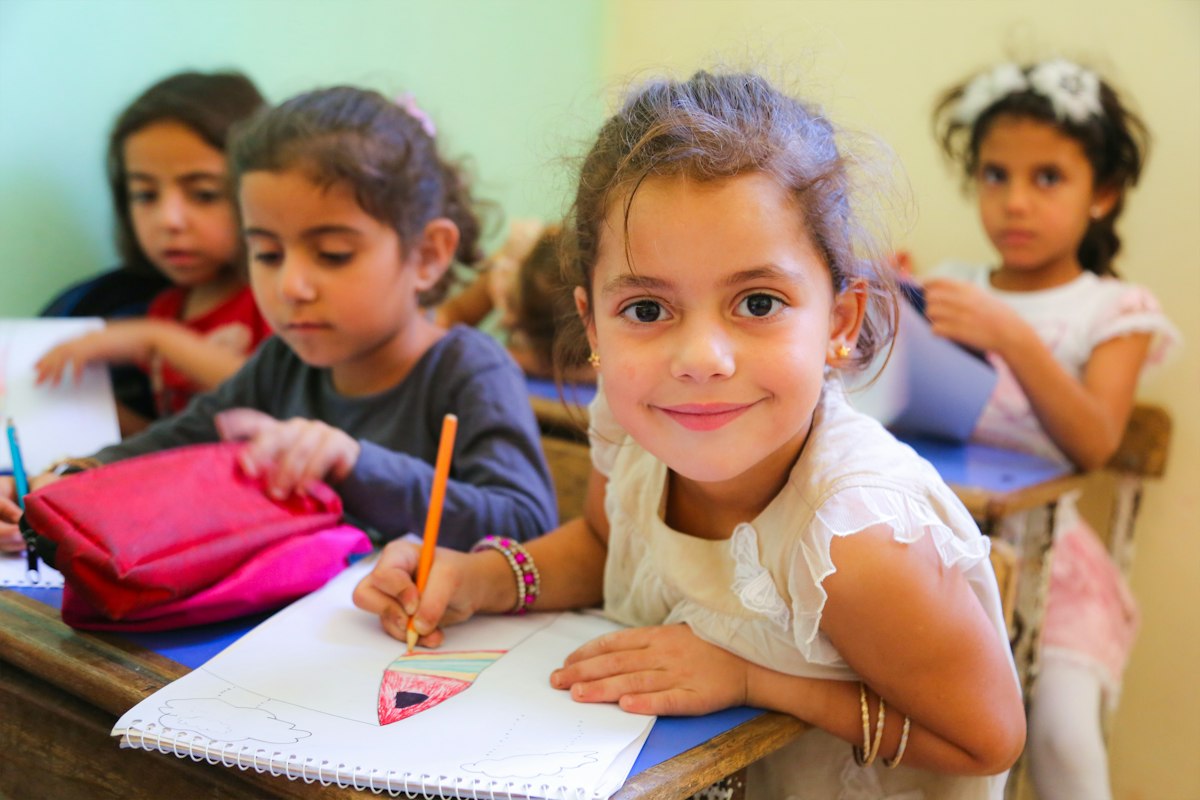 Young children learning in a bright classroom