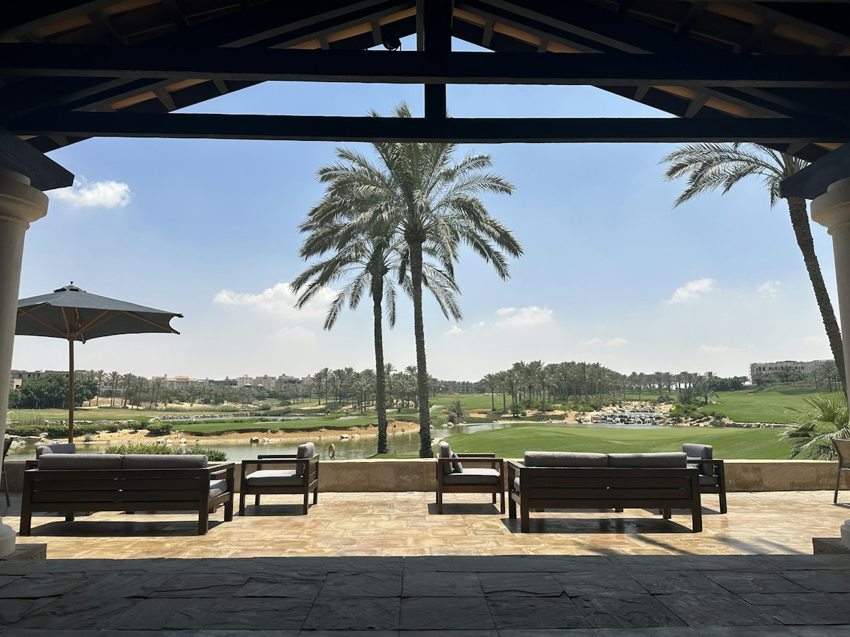 A golf course framed by palm trees
