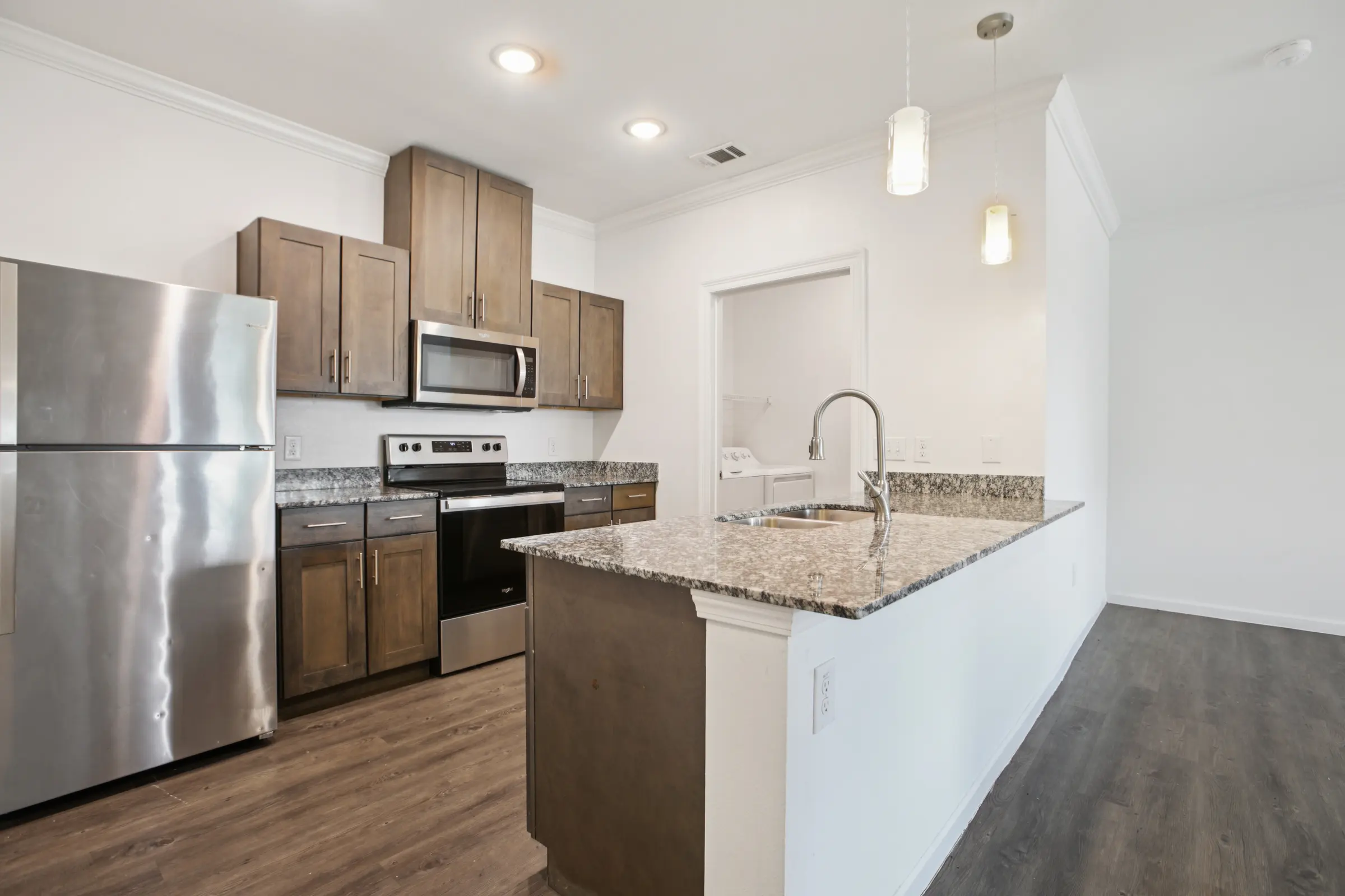 Kitchen area with bar and appliances