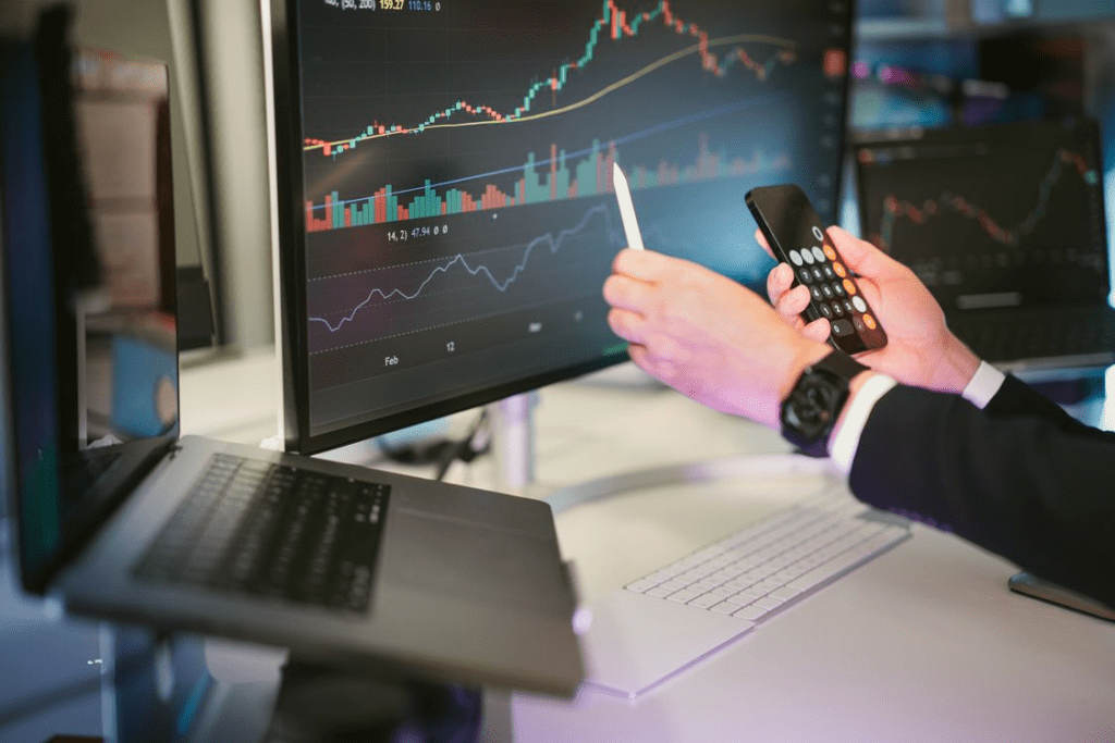 businessman pointing financial charts