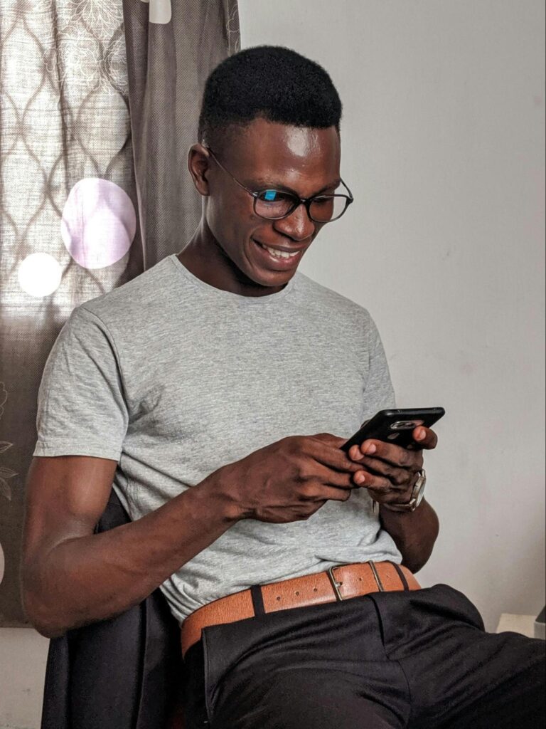 man happy to see he got on demand pay on his phone