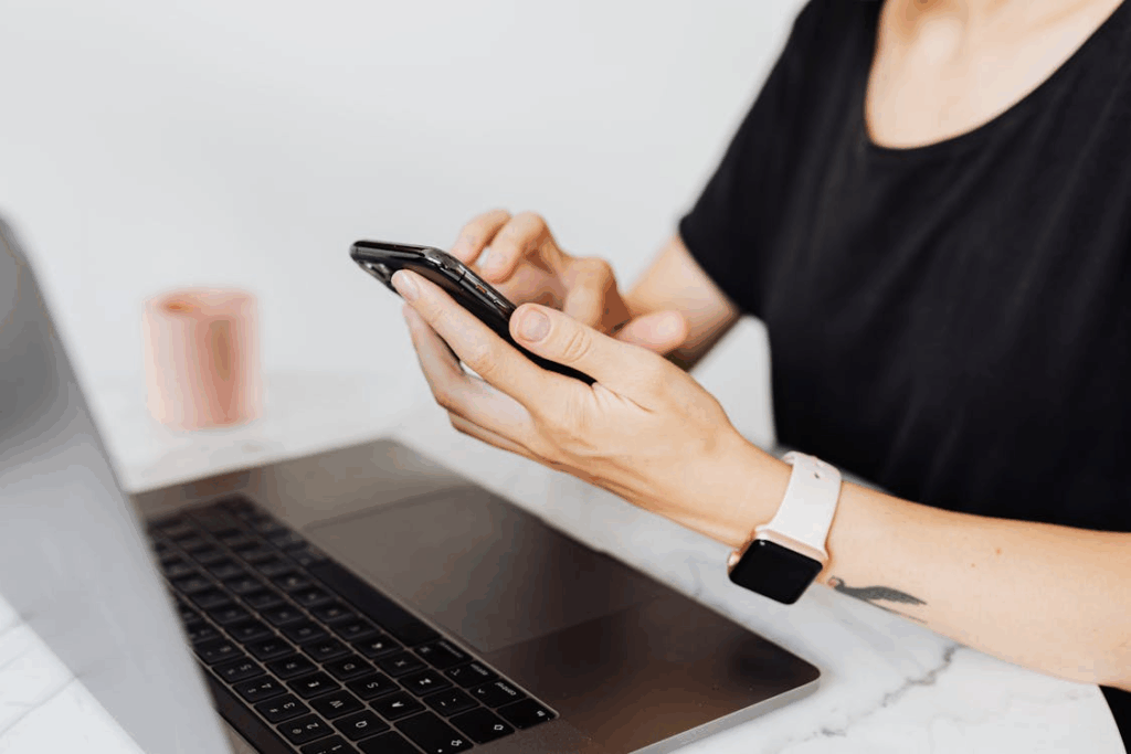 Woman Paying through mobile phone