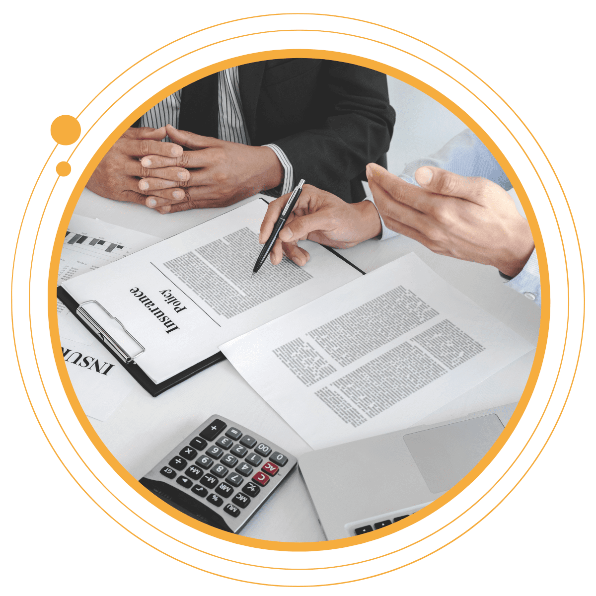 Two people reviewing an insurance policy document at a desk