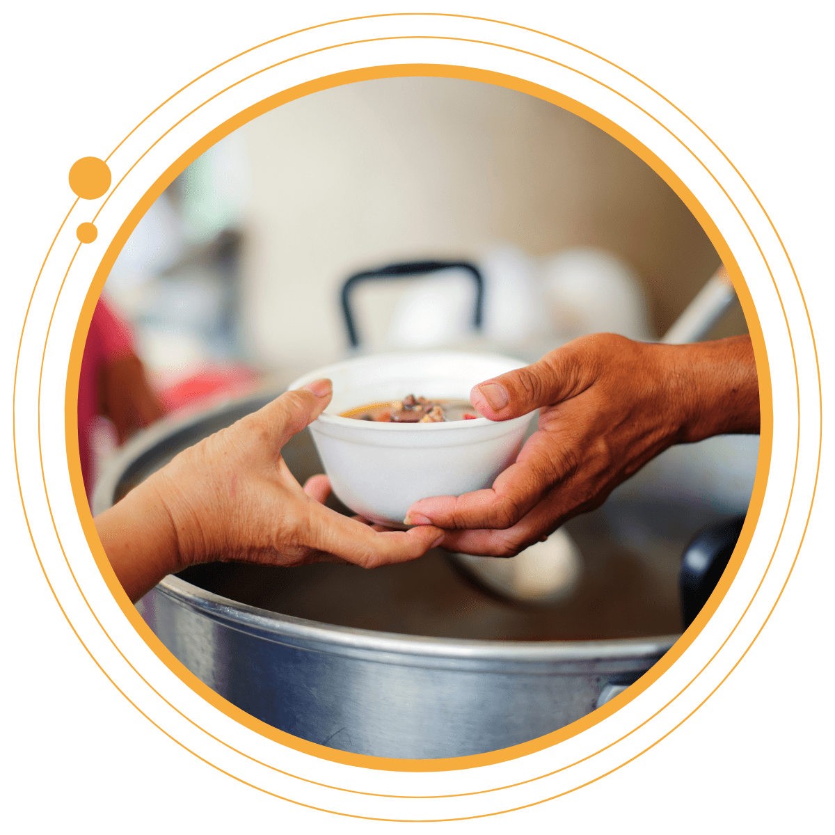 Volunteer handing a bowl of food to a person in need