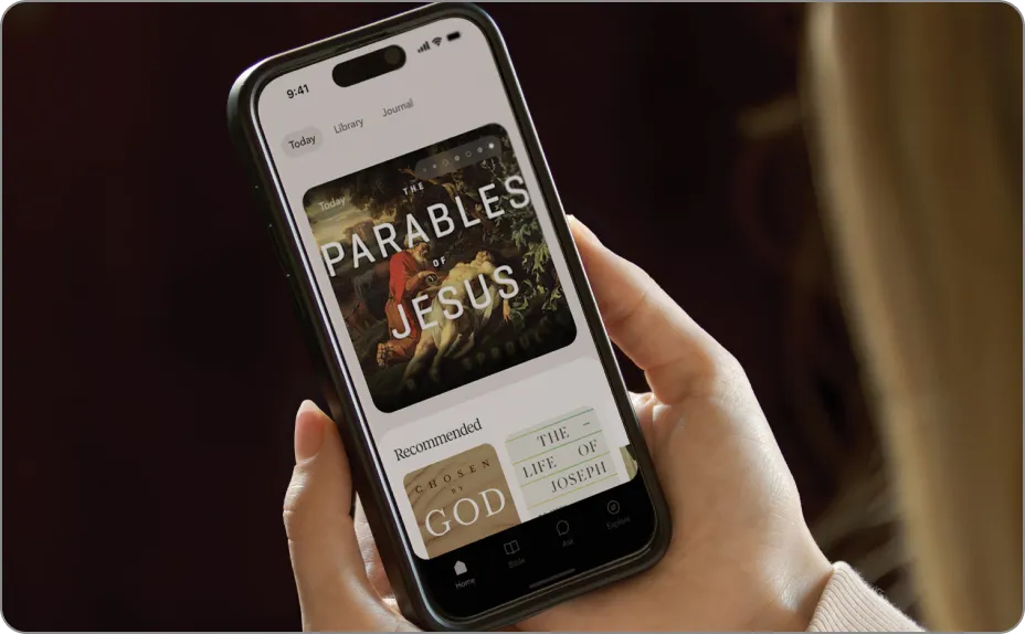 A hand holding a phone playing an R.C. Sproul teaching series in the Grow app