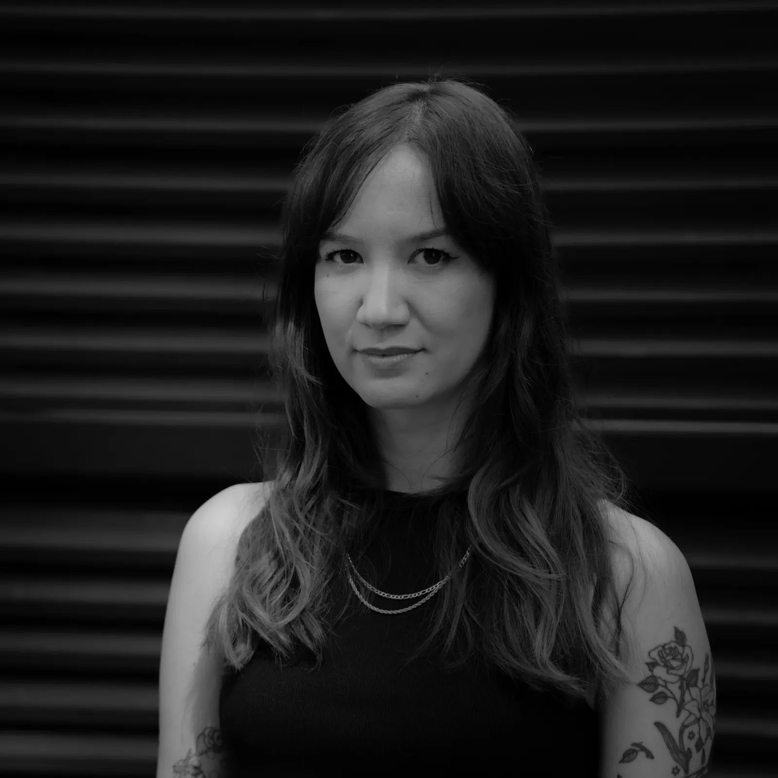 Portrait of Chloé Mickham, tattoo artist at SANS PATRIE/ STUDIO