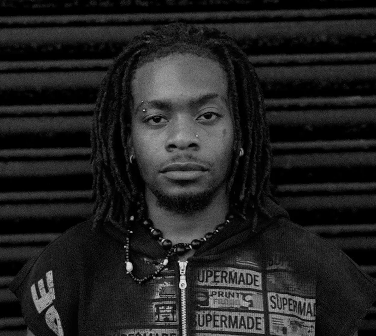 Portrait of TK, tattoo artist at SANS PATRIE/ STUDIO