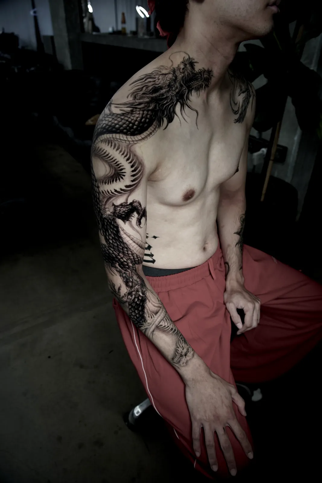 Blackwork dragon sleeve and chest tattoo by Sora at SANS PATRIE/ STUDIO