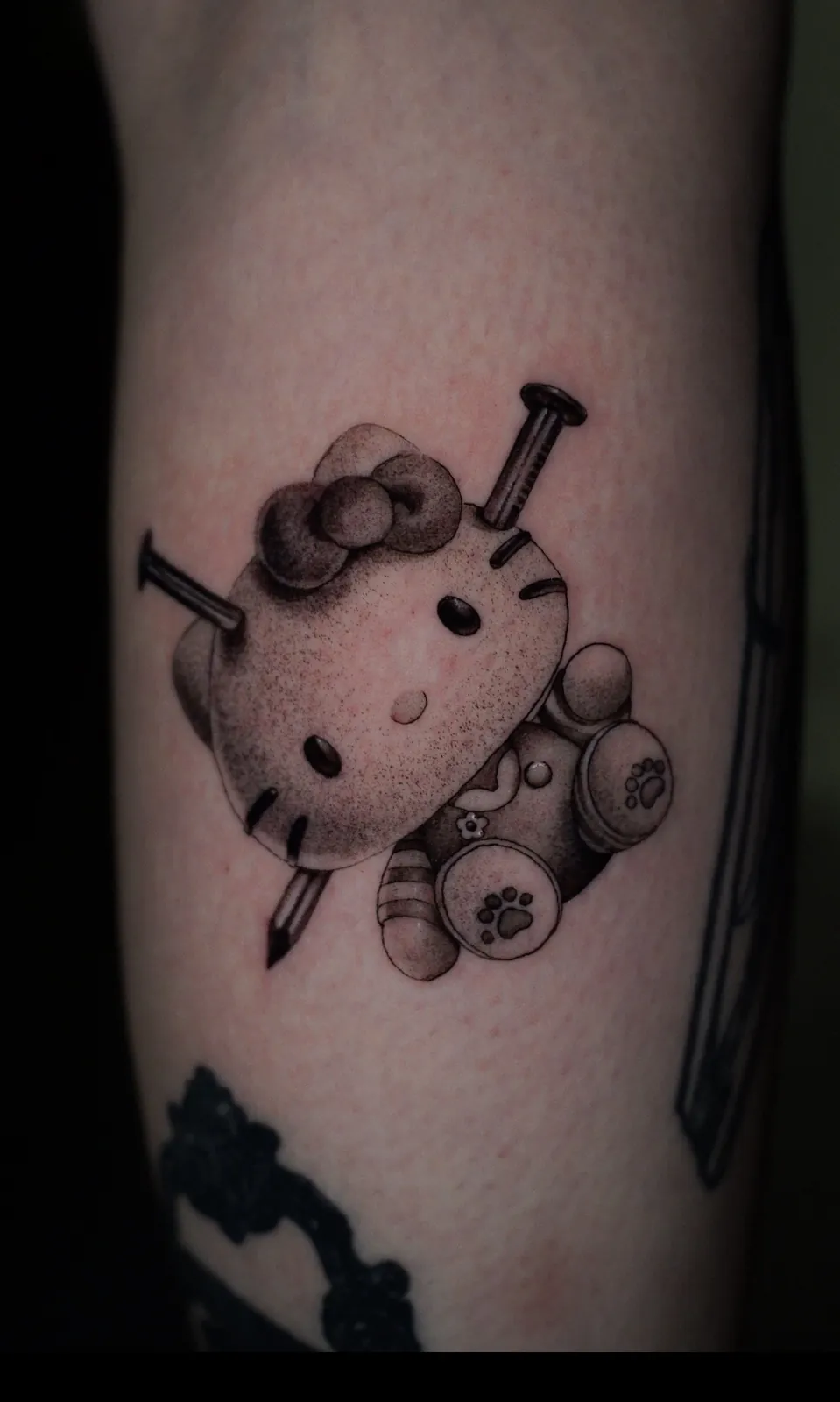 Black and grey cartoon cat tattoo by Draco at SANS PATRIE/ STUDIO
