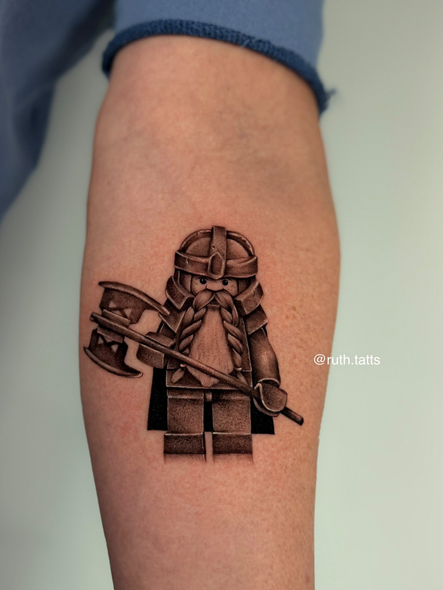 Micro-realism minifigure dwarf with axe tattoo by Ruth Bitton at SANS PATRIE/ STUDIO