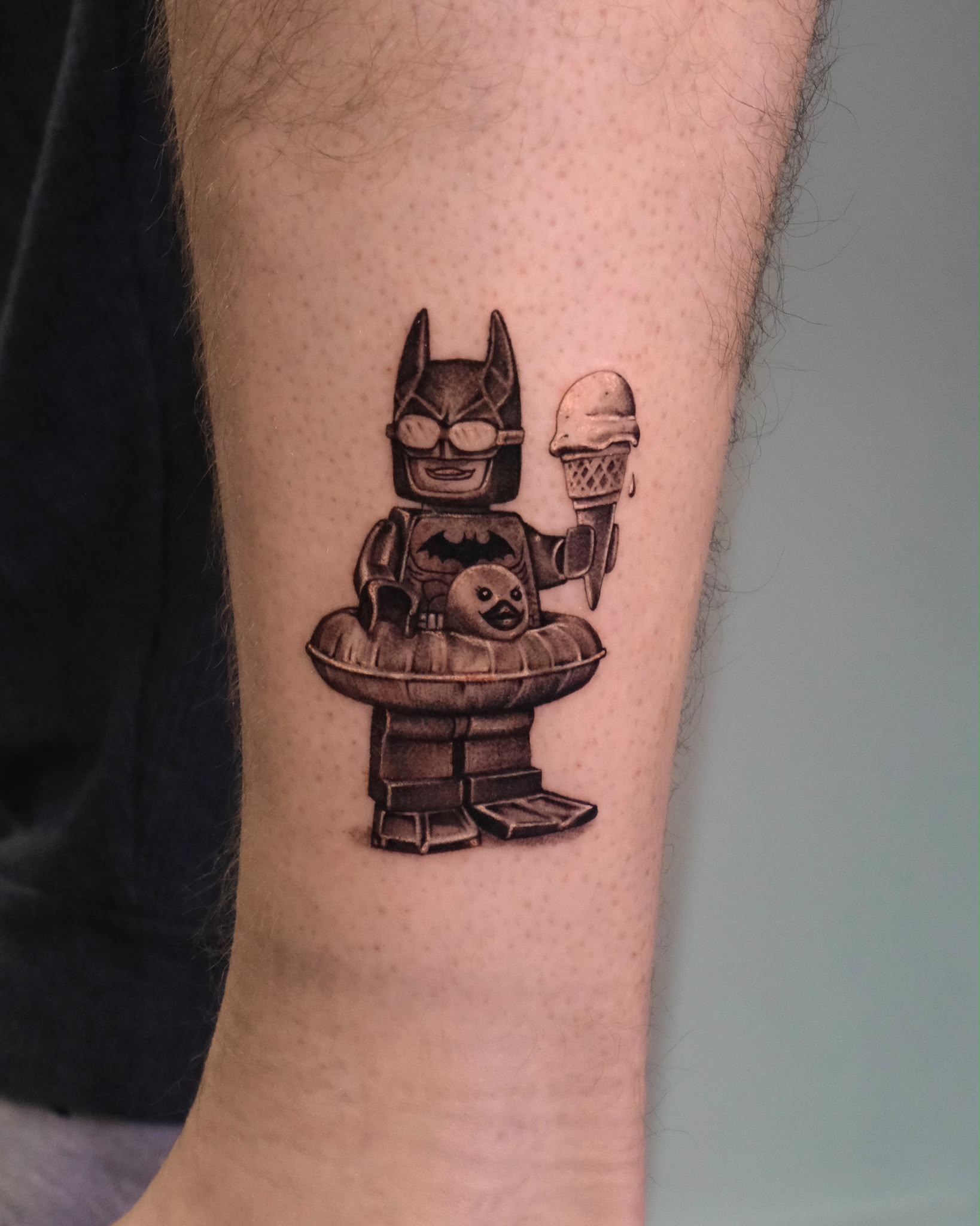 Micro-realism minifigure superhero with ice cream tattoo by Ruth Bitton at SANS PATRIE/ STUDIO