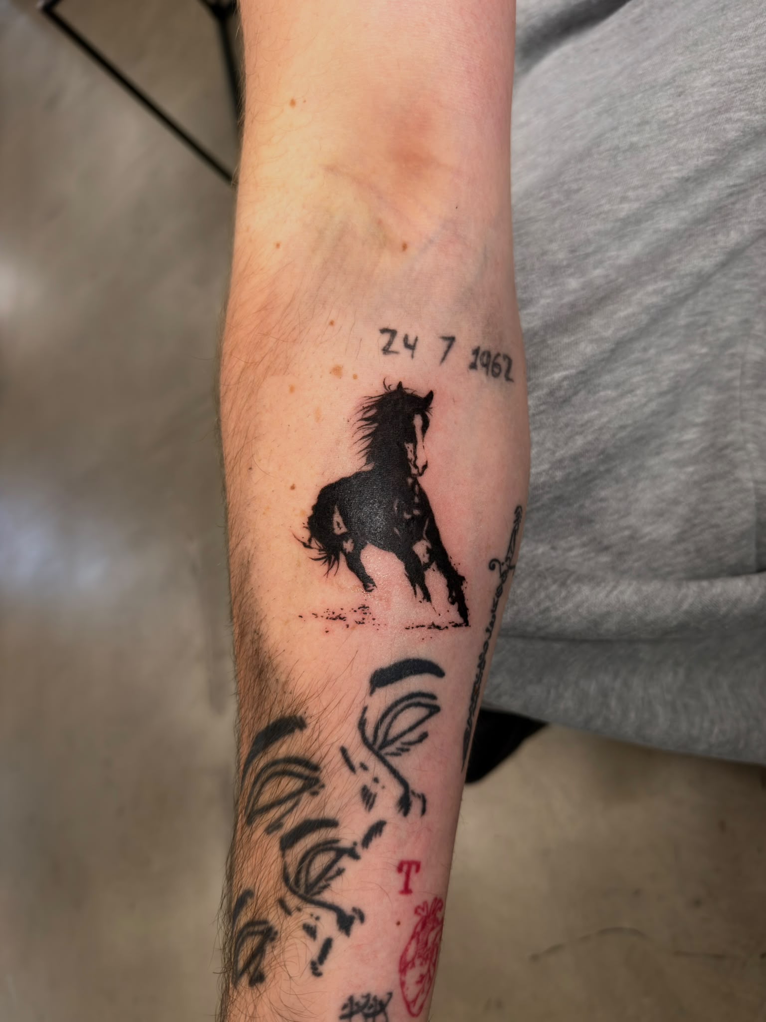 Blackwork horse forearm tattoo by Tyrese Gilzene at SANS PATRIE/ STUDIO