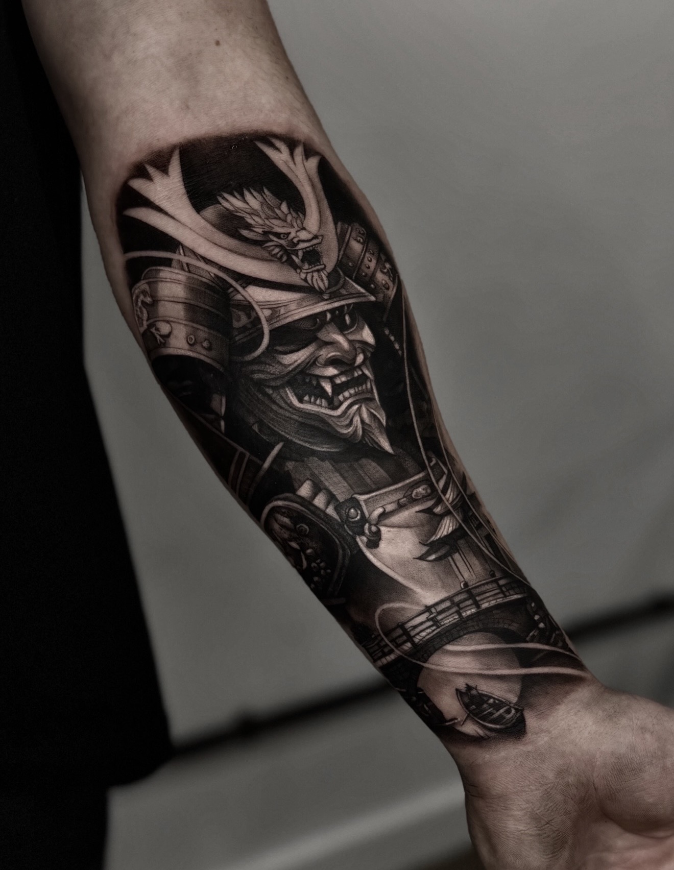 Black and grey samurai warrior forearm tattoo by Kayley Laroche at SANS PATRIE/ STUDIO