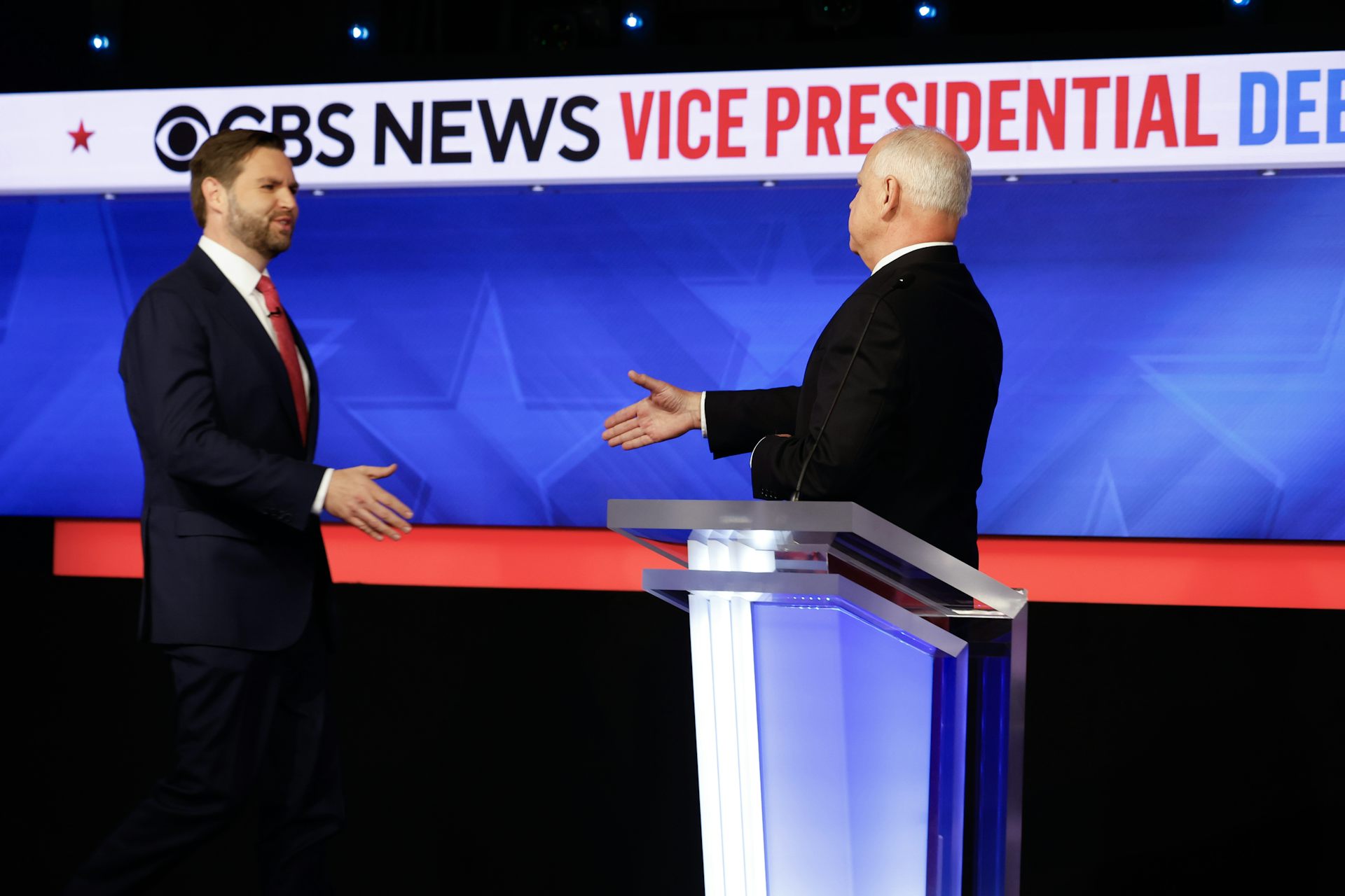JD Vance and Tim Walz shake hands before their debate