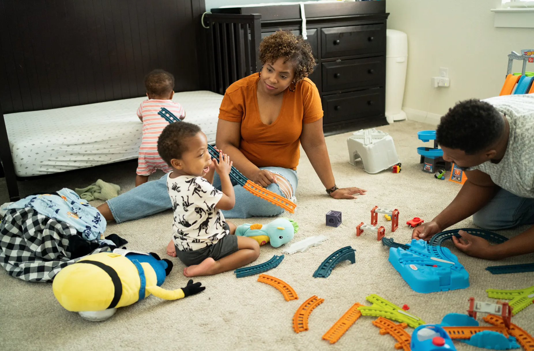 Ava Jones and her husband playing with their two sons