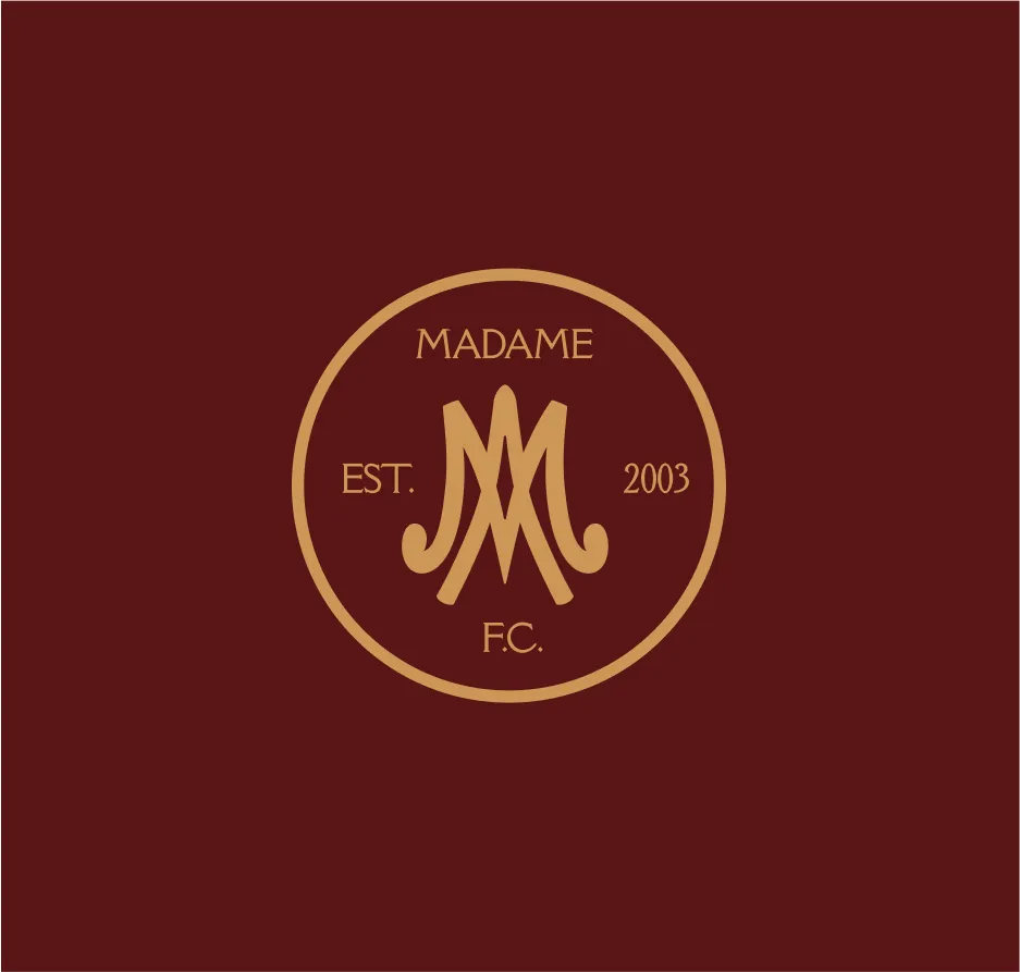 Madame F.C. crest on a burgundy background