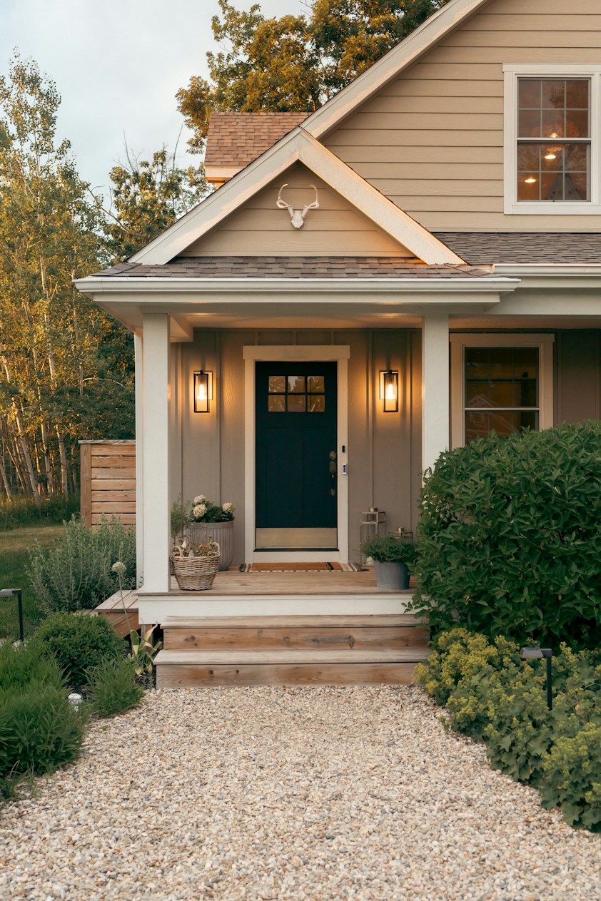 The front porch and gravel walkway of a cozy home