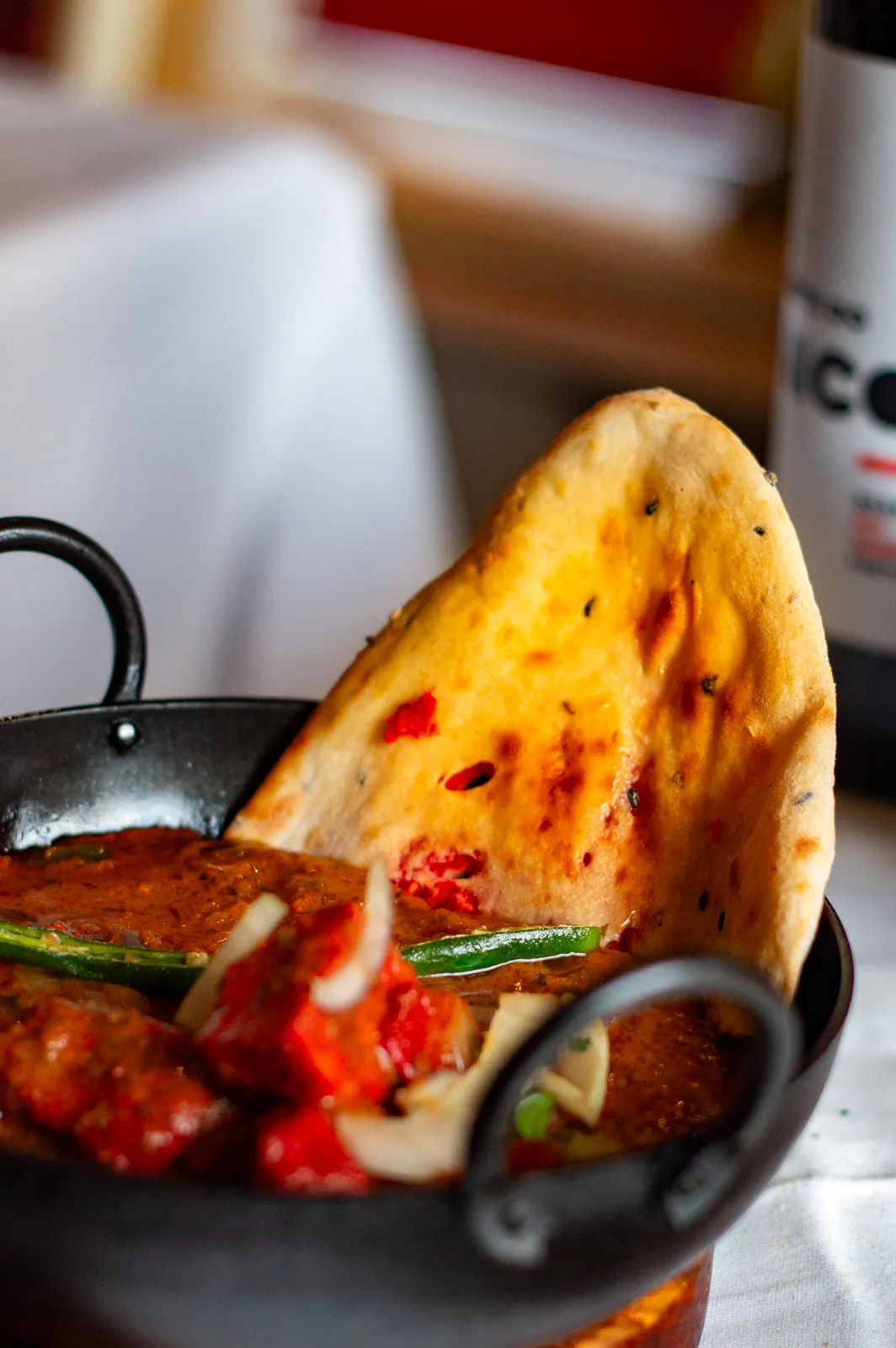 Karahi curry with green chilli and naan bread