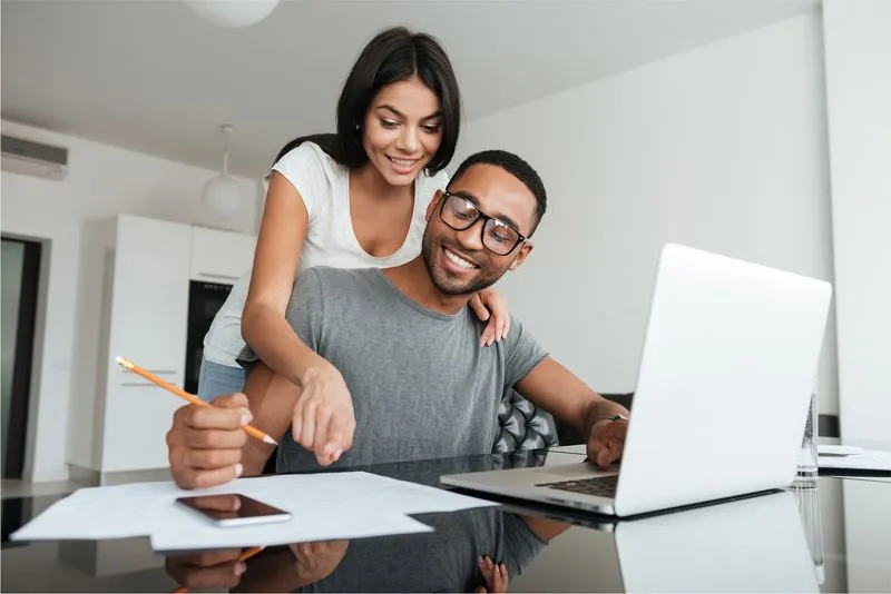 happy couple paying bill
