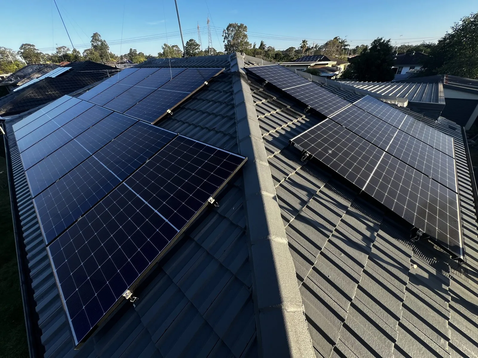 Completed solar-panel cleaning work across a metal roof
