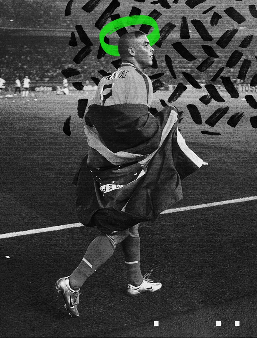 A Brazil number 9 walks the pitch wrapped in the national flag, a green halo brushed above his head