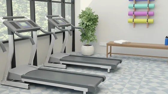 A gym floor rendered by Physicl Studio, treadmills, a bench and a plant