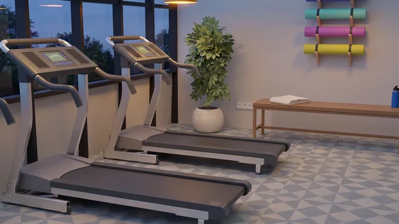 The same gym at dusk with the ceiling lights on, nothing else changed