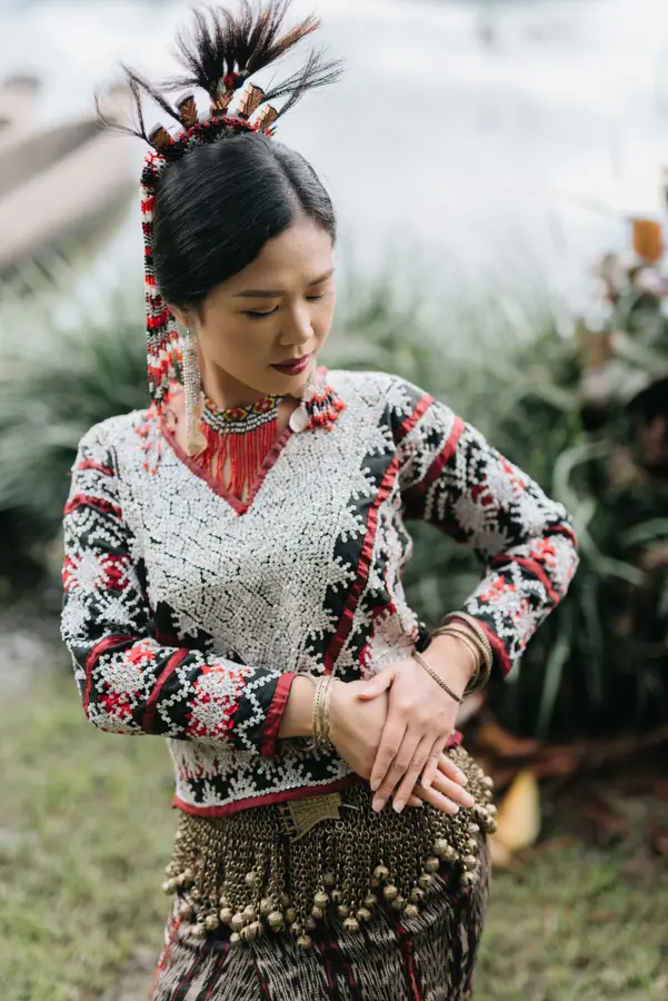 Cecille in Tboli dress, adjusting a beaded belt