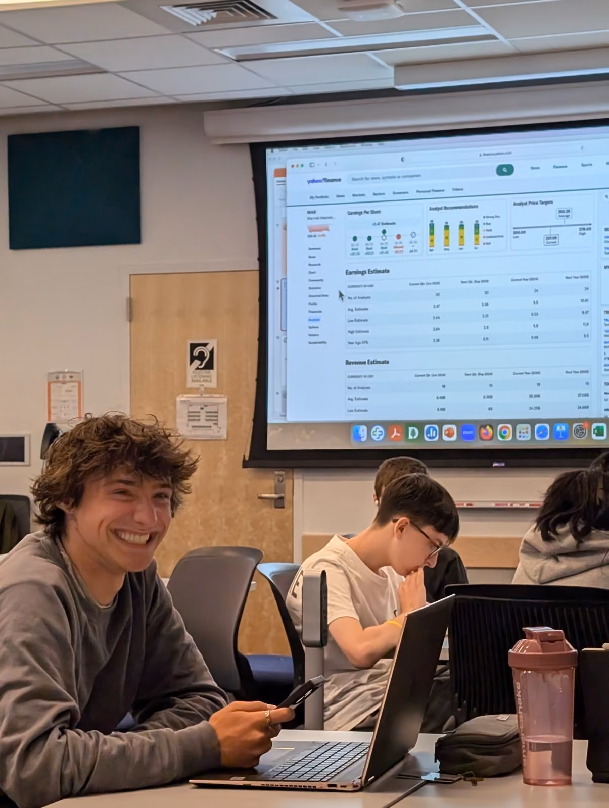 A student smiling during a finance class
