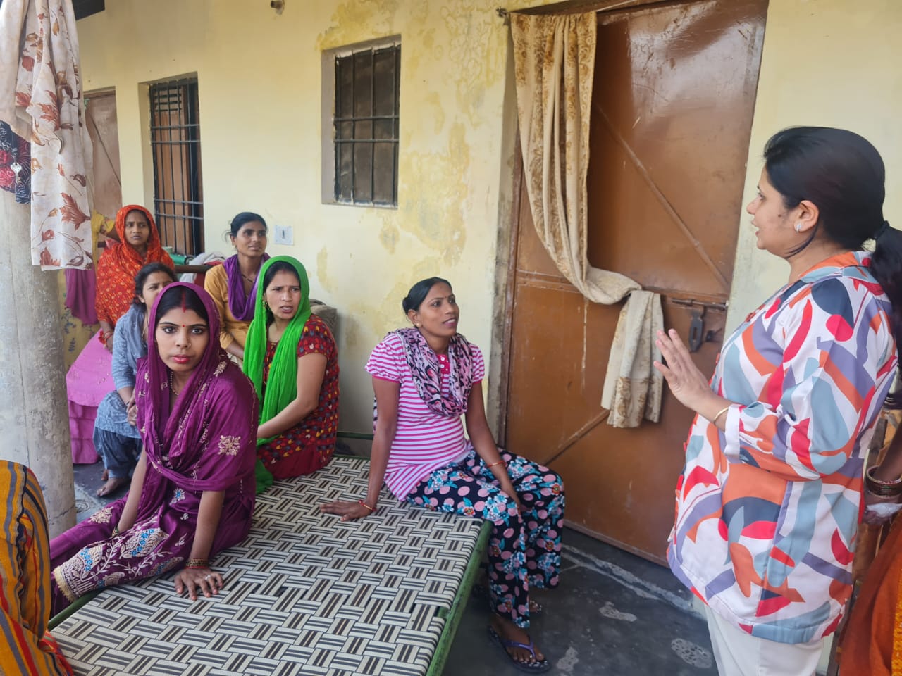 Dr. Monika Gupta from Pinkishe Foundation engages with women in a rural village, tackling deep-rooted menstrual health myths.