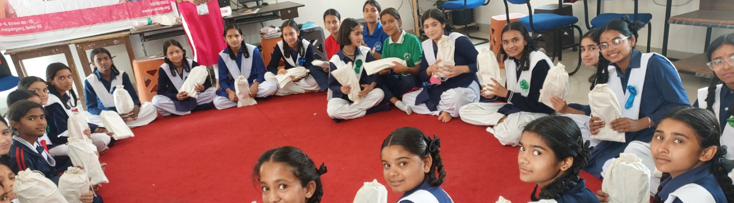Upasana Tulera, representing Pinkishe Foundation, addresses the importance of menstrual hygiene to girls at Government Girls Inter College Garjoli Kafulta.