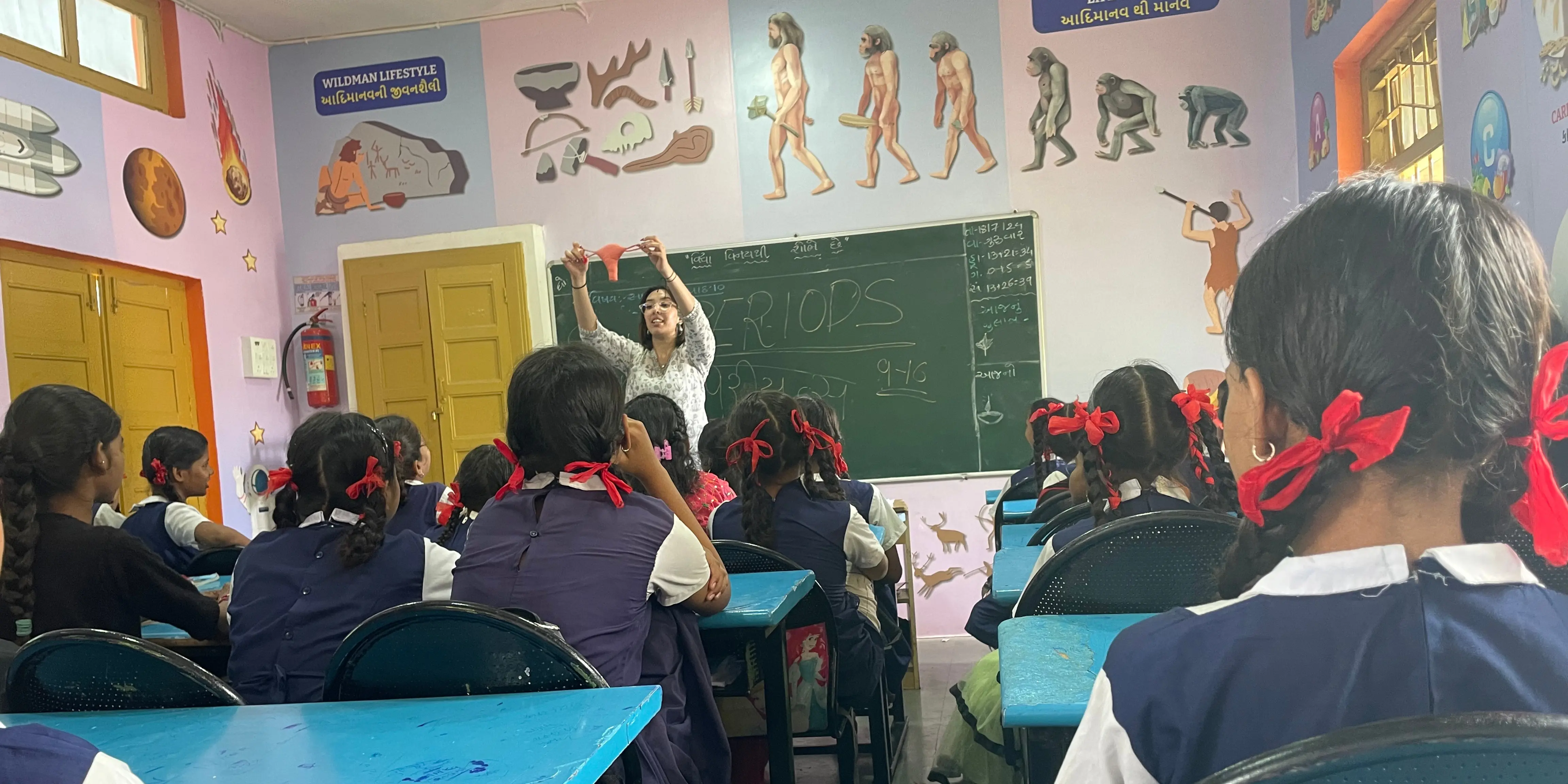 A heartfelt moment as Saasha Gajjar empathizes with three older girls who share cultural sensitivities about menstruation, supported by Pinkishe Foundation.