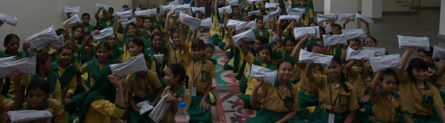 Girls at Good Samaritan School attentively participating in a menstrual hygiene literacy session organized by Pinkishe Foundation.