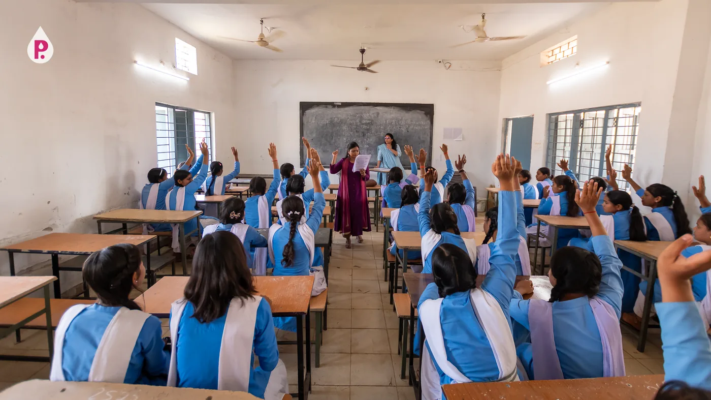 Girls raising their hands during a menstrual health class in Sakti, Chhattisgarh