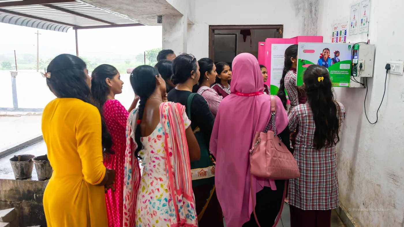 Schoolgirls and teachers with their school's pad vending unit, Nari Samman, Telangana