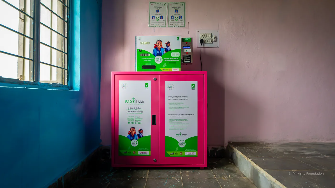 A pad vending machine and a pink pad storage cupboard in a government school in Telangana
