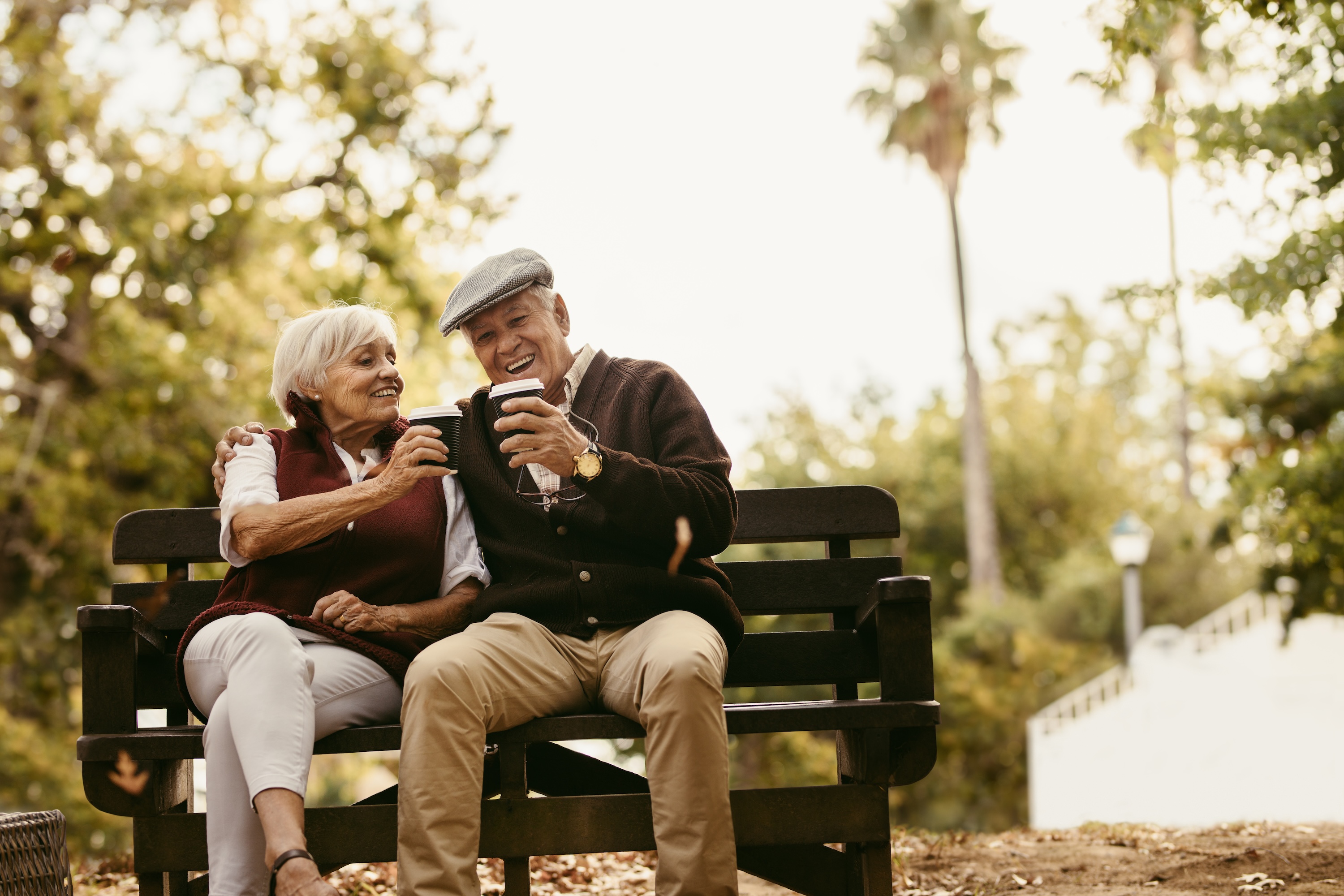 Senior couple sitting in park stock image 