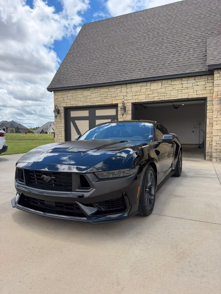Black Ford Mustang after a mobile maintenance detail in OKC