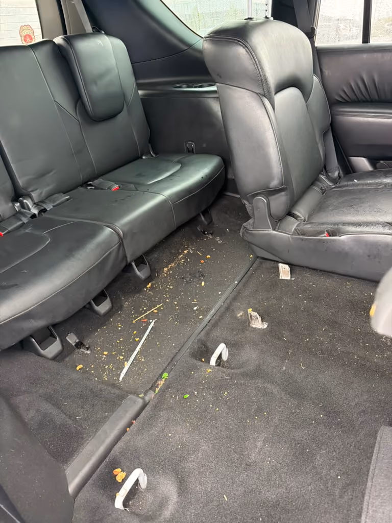 SUV third row and carpet before an interior car detail