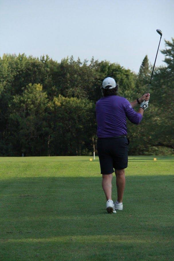 Golfer driving off the tee at Camden Braes