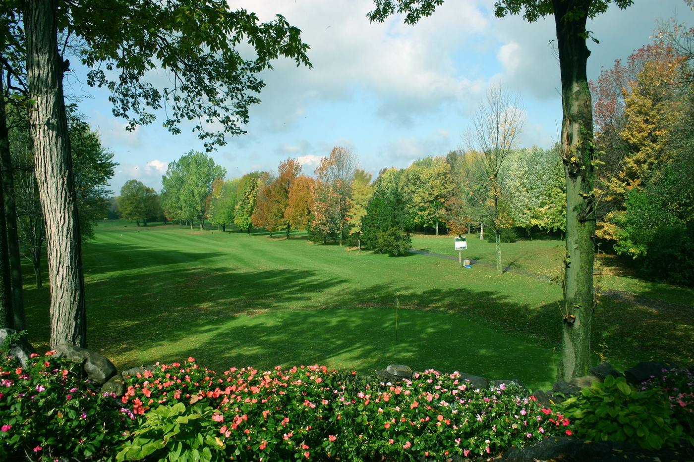 The 18th green and first tee in bloom