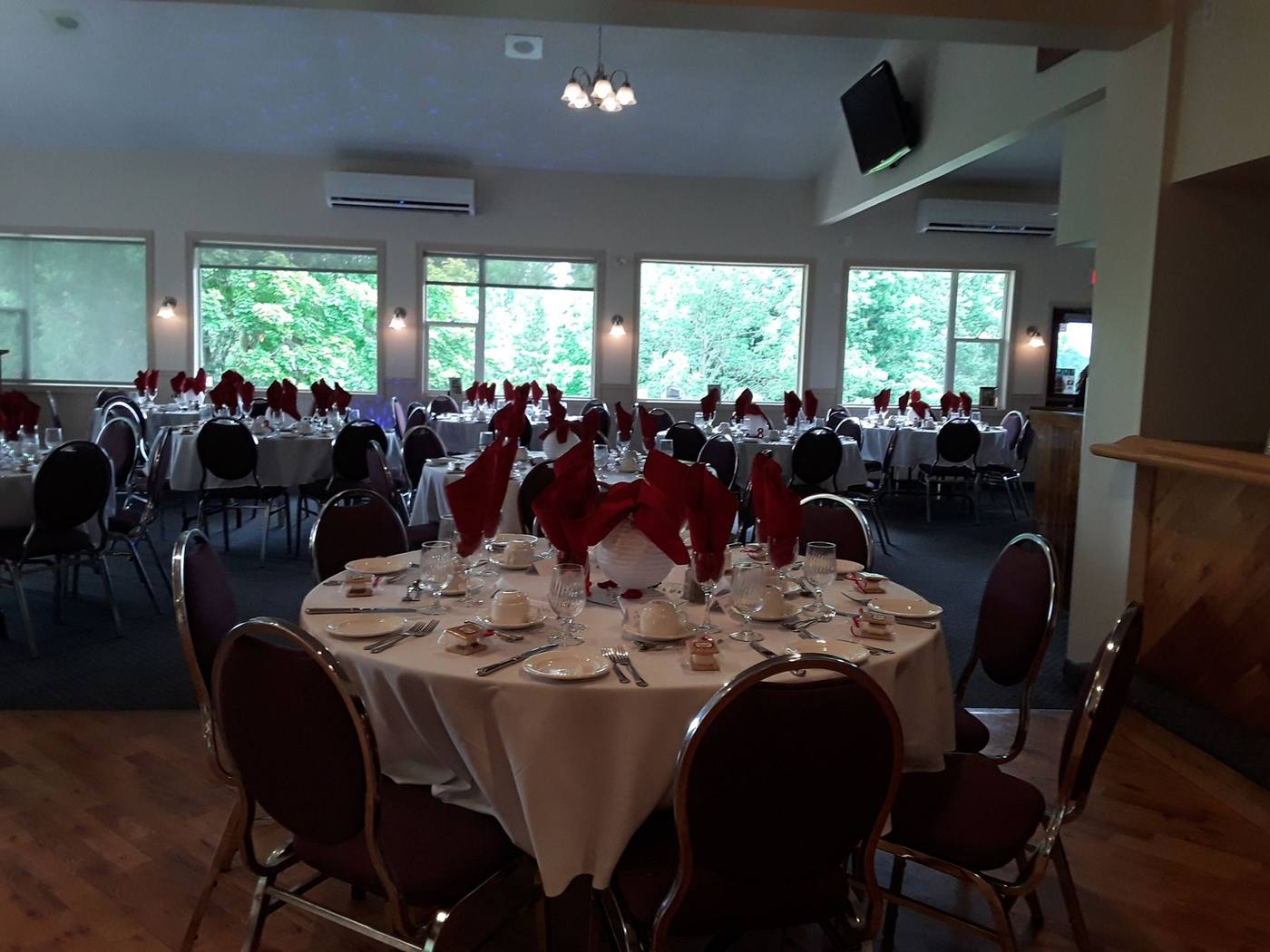 Dining room set with white linen for a full event