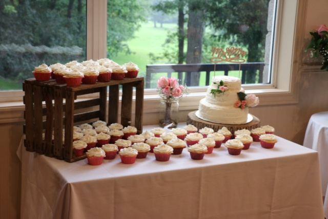 Wedding cake and cupcake table in the clubhouse