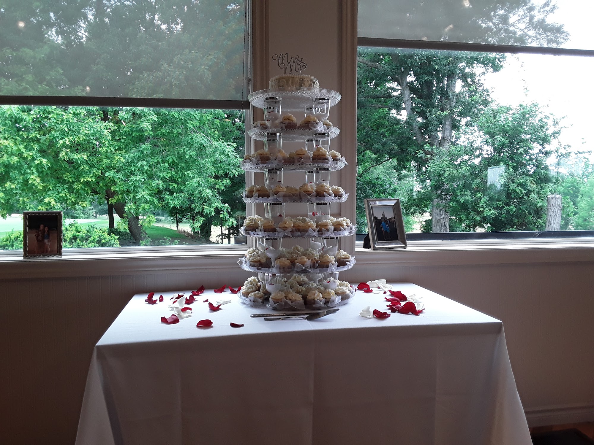 Wedding cupcake tower by the clubhouse windows