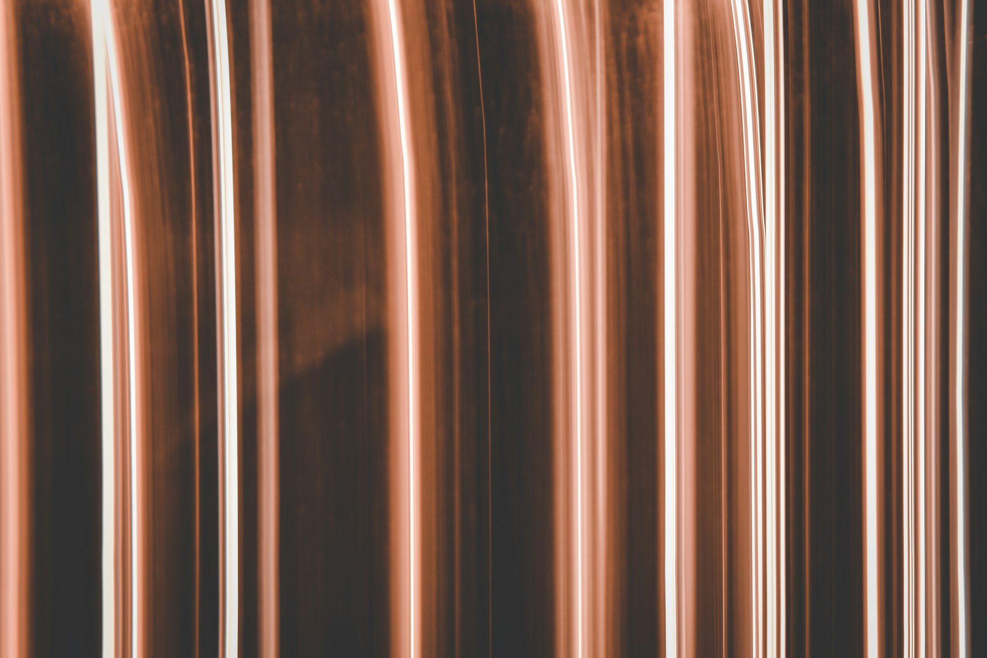 Abstract copper-toned artwork representing Enterprise Application Assurance.