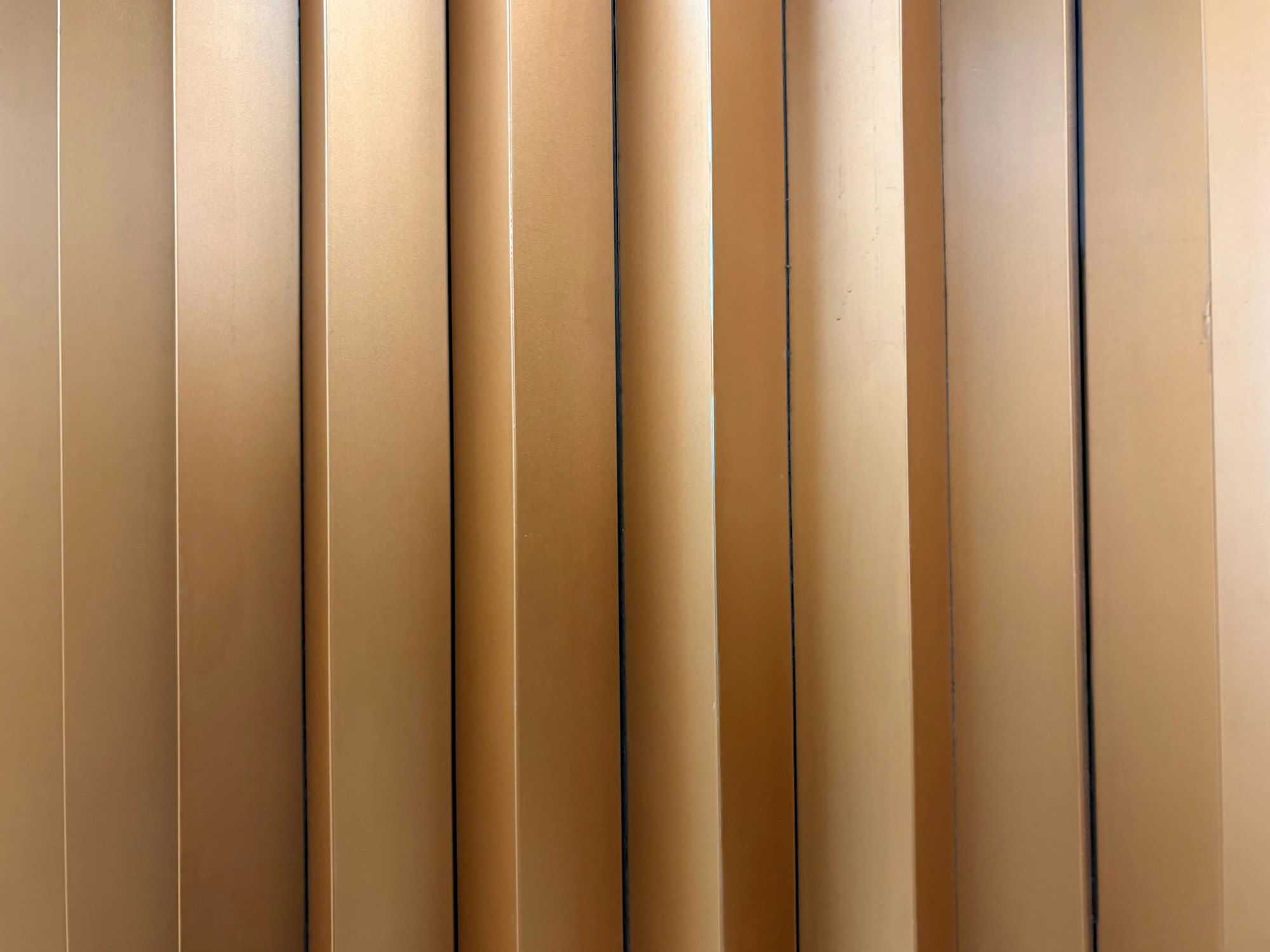 Abstract copper-toned artwork for the article: Construction Technology: Why the Gap Between Project, Field and Enterprise Matters