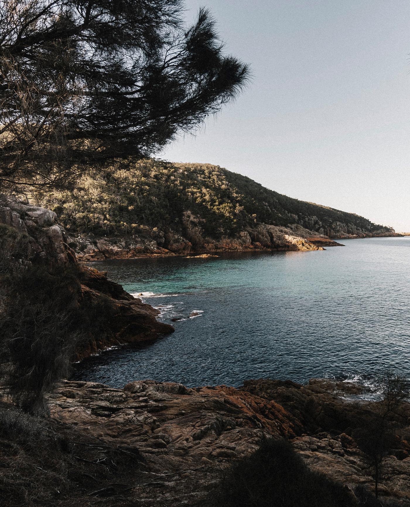 Rocky headland above calm water