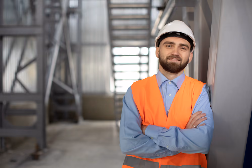 A technician working on production equipment in a clean, modern plant