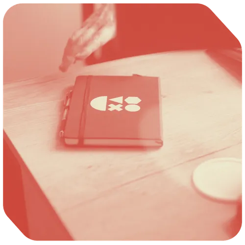 a hand reaching for a book on a table